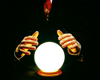 Hands above a crystal ball